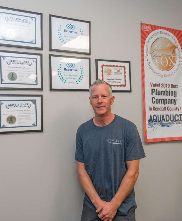 Oswego Plumber, Staff posing with awards - local plumbers in kendall county
